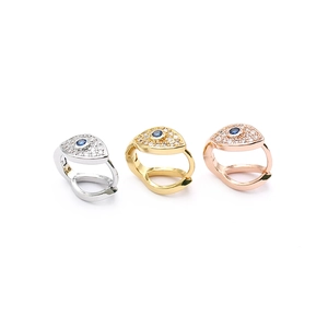 Macro view of 18K gold plated hoop earrings with micro-set zircons and blue eye charms