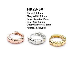 Detail view of heart-shaped hoop earrings in gold, silver and rose gold with 10mm inner diameter