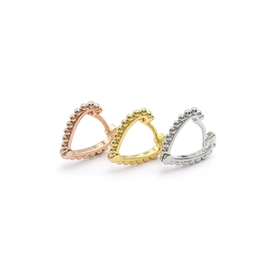 Detailed close-up of heart-shaped hoop earrings in gold, silver, and rose gold finishes
