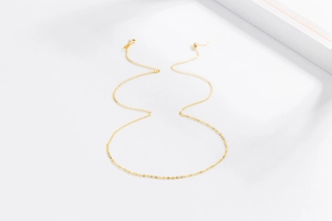 Close-up of polished gold S925 sterling silver Chopin chain with lobster clasp
