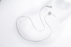 Detailed view of S925 sterling silver slider chain with hollow bead and needle clasp pin