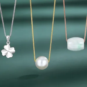 S925 sterling silver necklaces with pearl, clover, and jade beads on green background