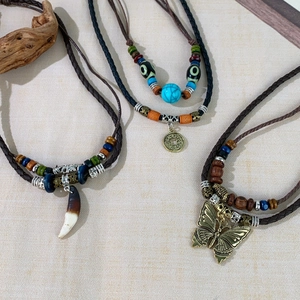 Ethnic layered beaded necklace set with wood beads and bronze butterfly pendant charms
