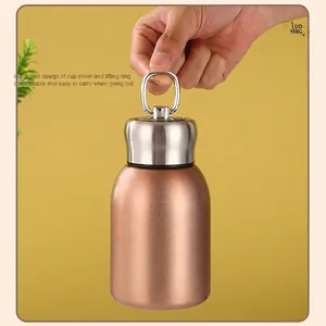 Portable rose gold stainless steel vacuum flask with integrated round carrying ring