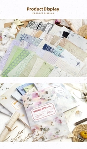 Detailed view of vintage paper set with mixed textures and die-cut patterns for scrapbooking