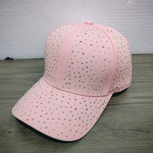 Detail shot of pink baseball cap with colorful rhinestones and sparkling crystal embellishments