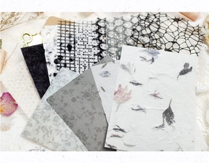 Detail of vintage scrapbooking paper with lace texture and pressed flower patterns