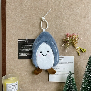 Close-up of a cute plush penguin coin purse on a cozy lifestyle aesthetic background