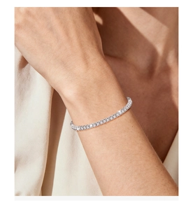 Macro shot of S925 sterling silver moissanite tennis bracelet on a model wrist