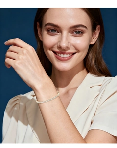 Close-up of a gold s925 silver tennis bracelet with round moissanite on a model wrist