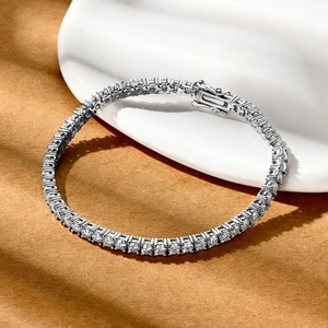 Macro shot of S925 sterling silver stamp and sparkling round-cut stones on tennis bracelet