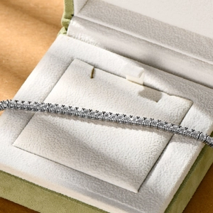 Close-up of S925 sterling silver moissanite tennis bracelet in a velvet jewelry box