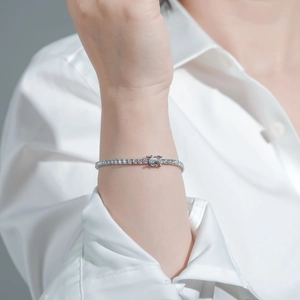 Close-up of S925 sterling silver moissanite tennis bracelet on a woman wrist