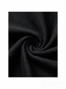 Macro texture of soft black denim fabric with fine knitted details and elastic texture