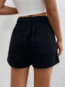 Women's vintage high-waisted black denim shorts with elastic drawstring waist and back pockets