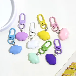 Eight-piece set of colorful resin cloud keychains in vibrant macaron shades on a white base