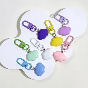 Colorful resin cloud keychains in pastel colors with matching carabiner hooks