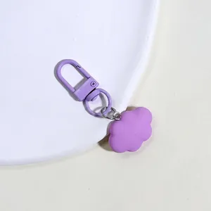 Close-up of a lavender purple cloud charm keychain with a matching metal lobster clasp