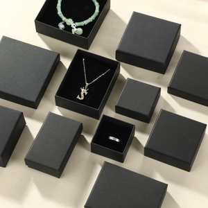 Minimalist black matte cardboard jewelry gift boxes with plush liners for rings and necklaces