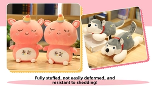 Detail of plush unicorn and husky pillows made of soft fabric with dense filling