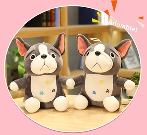 Detail of two plush French Bulldog dolls with soft grey fur and cute paw print designs