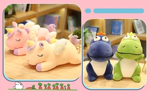 Close-up of soft plush unicorn and dinosaur dolls in pink, beige, blue and green colors