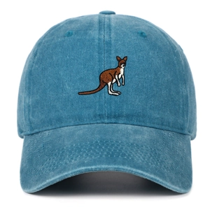 Close-up of embroidered kangaroo patch on vintage washed blue cotton baseball cap