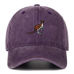 Detail of embroidered kangaroo logo on vintage washed purple cotton baseball cap