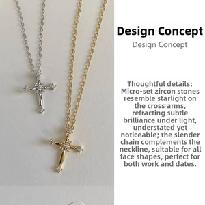 Detailed view of silver and gold cross necklaces with sparkling zircon inlay design