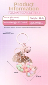 Detailed view of pink candy keychain with dimensions six by three point seven centimeters