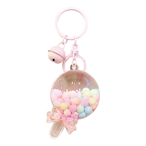 Cute pink lollipop keychain with macaron beads and white glitter in clear acrylic ball