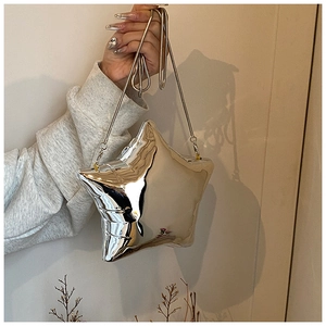 Detailed view of silver star acrylic clutch with high-gloss mirror finish and chain