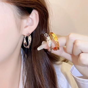 Silver multi-layer interwoven C-shape hoop earrings for a minimalist fashion look