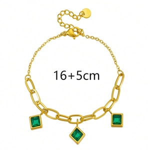 Detail view of 16+5cm gold paperclip chain bracelet with square emerald green stones