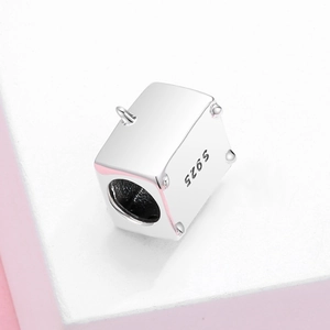 S925 sterling silver pig oven charm bead on a geometric white display stand