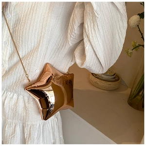 Mini star-shaped acrylic evening bag with gold mirror finish and fine chain strap