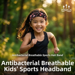 Detail of breathable black headband with red heart print on child running in nature