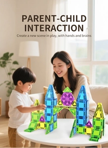 Mother and child building a large 3D castle with colorful magnetic building blocks