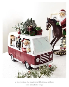 Detailed resin Christmas RV ornament featuring Santa driving polar animals with rooftop tree