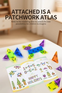 Close-up of DIY magnetic tiles with educational guidebook showing 2D animal and math shapes