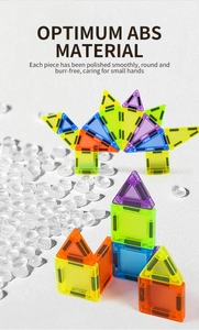 Detailed view of polished ABS magnetic tiles showing smooth edges and vivid dinosaur shapes
