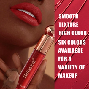 Detailed texture of waterproof matte red liquid lipstick and application on dark skin