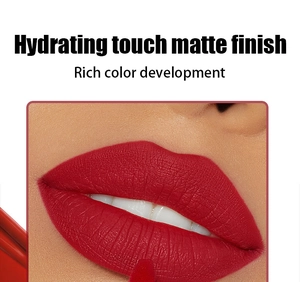Detailed macro shot of matte red liquid lipstick showing rich pigment and smooth texture