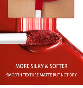 Macro detail of matte red liquid lipstick showing silky texture and soft applicator brush