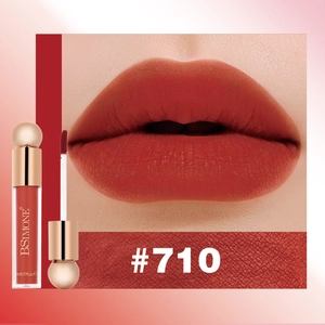 Macro shot of matte brick red liquid lipstick shade #710 showing velvet texture and applicator