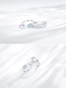 Detailed macro view of S925 sterling silver shooting star rings with blue enamel and zircon