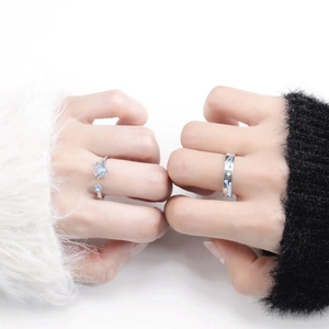 Luminous sterling silver star couple rings with blue enamel and sparkling stone details