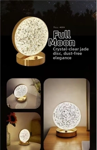 Detail of crystal texture night light with gold base in warm light settings