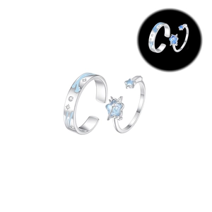 Luminous sterling silver star and meteor couple rings shown in bright and dark view