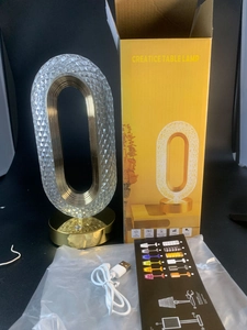 Macro view of crystal ring lamp with diamond texture and gold base for gift lighting